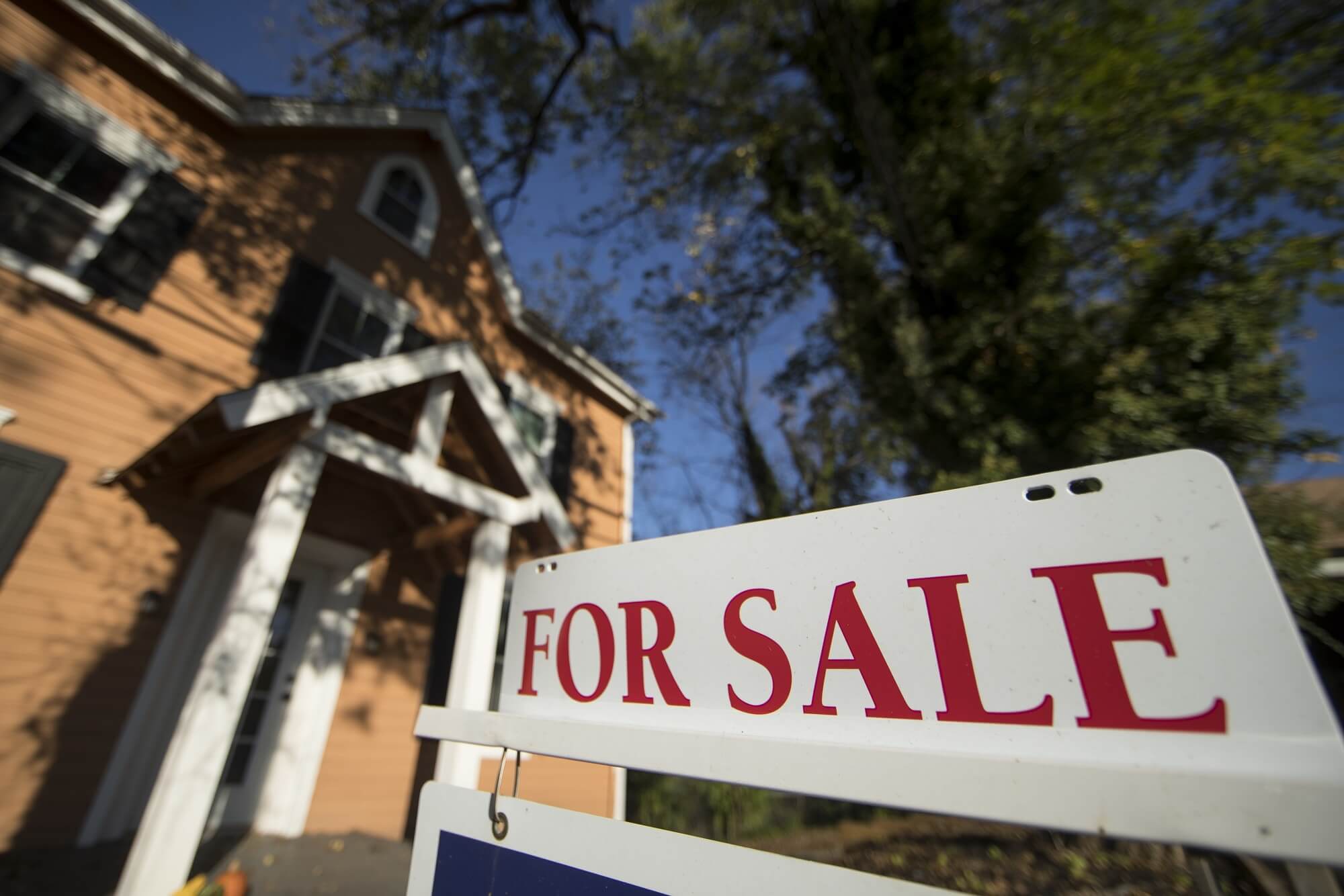 a sign for a home for sale